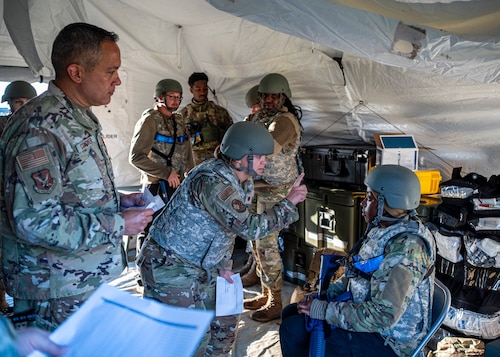 U.S. Air Force Maj. Stacy Madden, 23rd Medical Group beneficiary care clinic flight commander, checks an Airman’s vision during Exercise Ready Tiger 24-1 at Avon Park Air Force Range, Florida, April 14, 2024. Medical personnel triaged and simulated care for multiple casualties of an air and ground attack on the contingency location. Ready Tiger 24-1 is a readiness exercise demonstrating the 23rd Wing’s ability to plan, prepare and execute operations and maintenance to project air power in contested and dispersed locations, defending the United States’ interests and allies. (U.S. Air Force photo by Airman 1st Class Leonid Soubbotine)