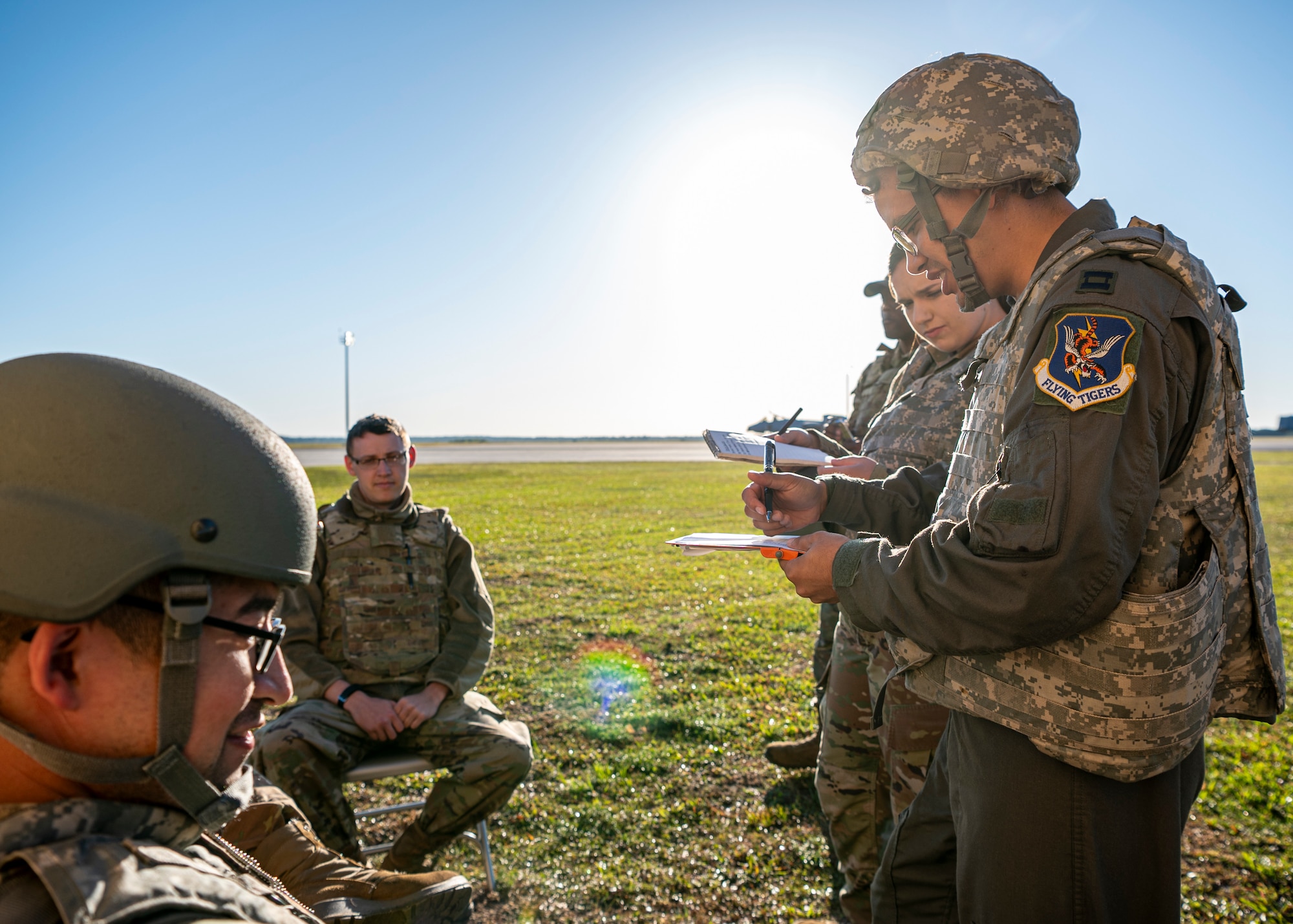 U.S. Air Force Capt. Matthew Monte, 23rd Medical Group flight surgeon, assesses several simulated casualties during Exercise Ready Tiger 24-1 at Avon Park Air Force Range, Florida, April 14, 2024. Medical personnel triaged and simulated care for multiple casualties of an air and ground attack on the contingency location. Built upon Air Combat Command's directive to assert air power in contested environments, Exercise Ready Tiger 24-1 aims to test and enhance the 23rd Wing’s proficiency in executing Lead Wing and Expeditionary Air Base concepts through Agile Combat Employment and command and control operations. (U.S. Air Force photo by Airman 1st Class Leonid Soubbotine)