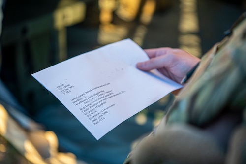 A U.S. Air Force Airman assigned to the 23rd Wing reads the simulated casualty card during Exercise Ready Tiger 24-1 at Avon Park Air Force Range, Florida, April 14, 2024. Airmen were given worksheets with various health stats and injuries to challenge the medical personnel’s response to the mass casualty event. Built upon Air Combat Command's directive to assert air power in contested environments, Exercise Ready Tiger 24-1 aims to test and enhance the 23rd Wing’s proficiency in executing Lead Wing and Expeditionary Air Base concepts through Agile Combat Employment and command and control operations. (U.S. Air Force photo by Airman 1st Class Leonid Soubbotine)