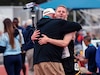 Team Army Coach Chris Uggiano embraces U.S. Army Spc. Timothy Capps after finishing his race on June 6, 2023, during the Department of Defense Warrior Games Challenge. (U.S. Army photo by Sgt. Anthony Hopper)