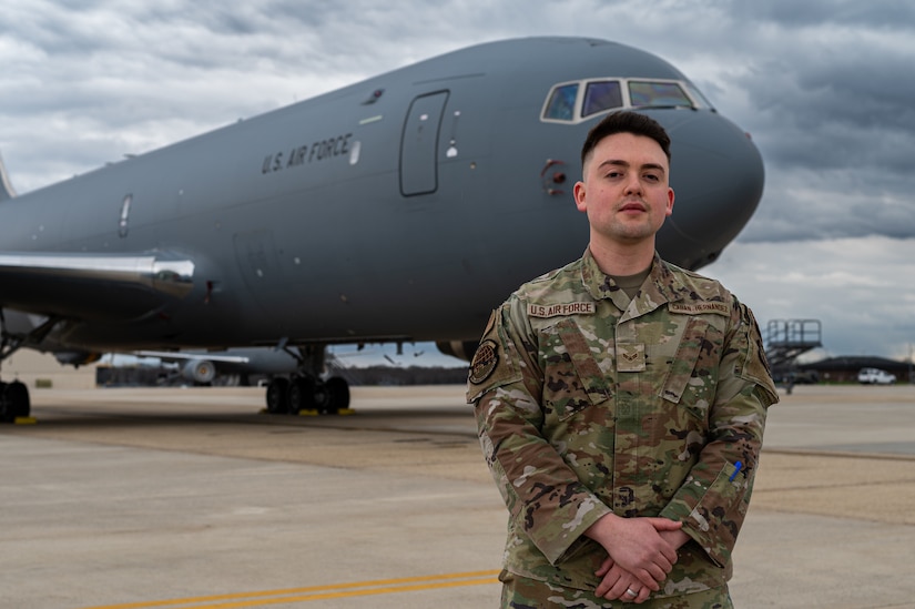 U.S. Air Force Airman 1st Class Bryan Caban-Hernandez, 305th Operations Support Squadron all source intelligence analyst, stands in front of a KC-46 Pegasus at Joint Base McGuire-Dix-Lakehurst, N.J., April 4, 2024. The 305th OSS played a crucial role in developing the scenario for the training missions, showcasing in-depth intelligence analysis and tactics preparation integral to the success of the exercise. (U.S. Air Force photo by Senior Airman Sergio Avalos)