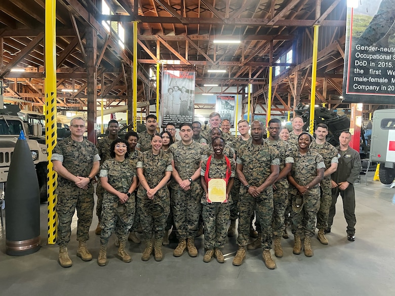 U.S. Marines with Marine Aircraft Group 39, 3rd Marine Aircraft Wing, pose for a photo after a meritorious promotion ceremony for Cpl. Celia G. Flomo, a supply clerk with MAG-39, at Marine Corps Air Station Camp Pendleton, California, March 25, 2024. Flomo was meritoriously promoted to the rank of corporal for demonstrating exceptional leadership, knowledge, and physical fitness, and standing out amongst her peers while taking on the responsibilities and duties of a higher grade. (Courtesy photo