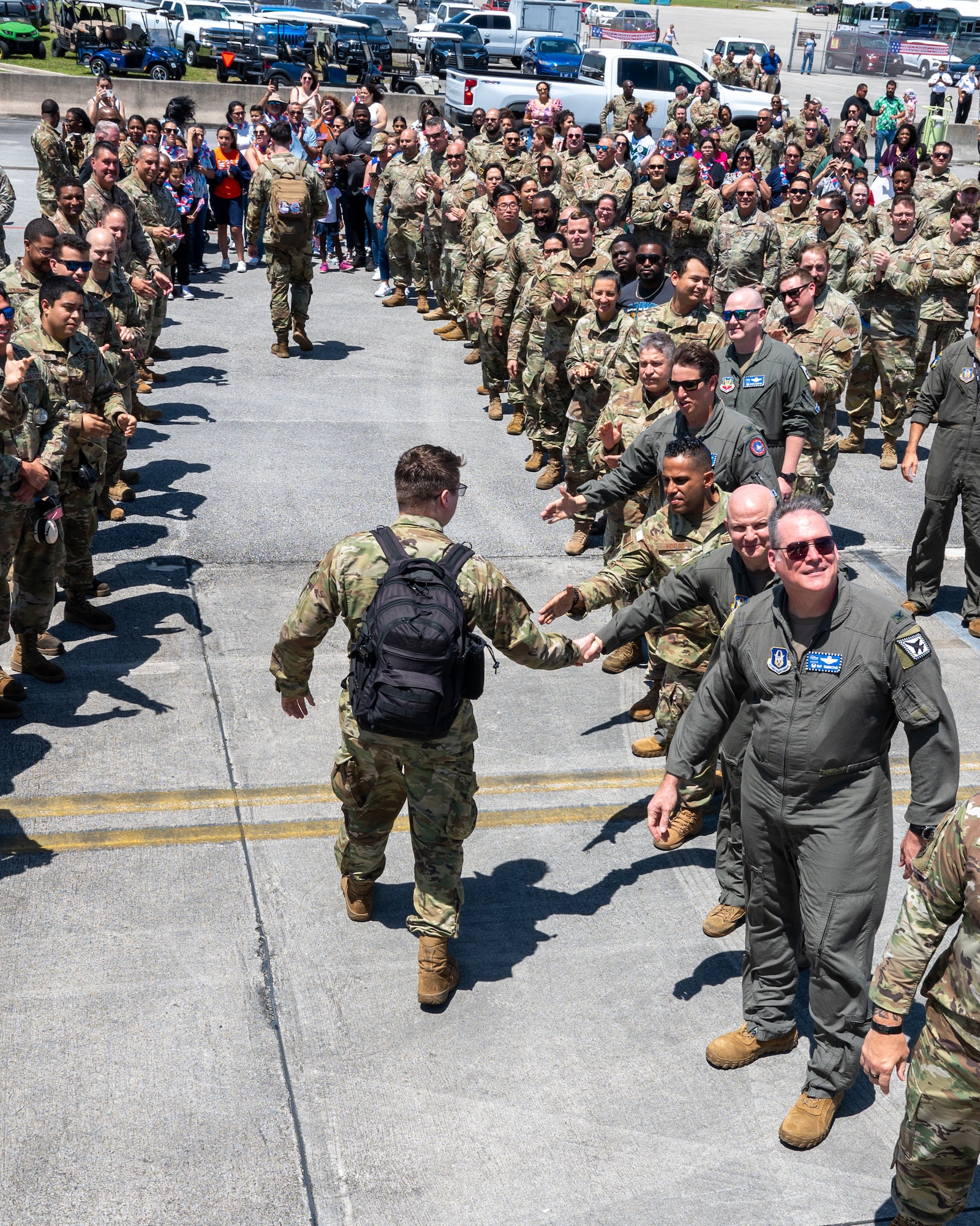 Airmen from the 482d Fighter Wing are warmly greeted by wing leadership, fellow Airmen, family, and friends as they walk between a crowd upon their return to Homestead Air Reserve Base, Florida, April 3, 2024, after their successful support of Operation Noble Eagle.