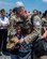 Master Sgt. Javier Pino, 482d Medical Squadron, is joyfully reunited with his sons at Homestead Air Reserve Base, Florida,  April 3, 2024. His team's efforts were pivotal in NORAD's continuous mission to monitor and secure North American airspace in Operation Noble Eagle. (U.S. Air Force photo by Tech. Sgt. Lionel Castellano)