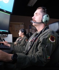 photo of US military personnel flying at simulators