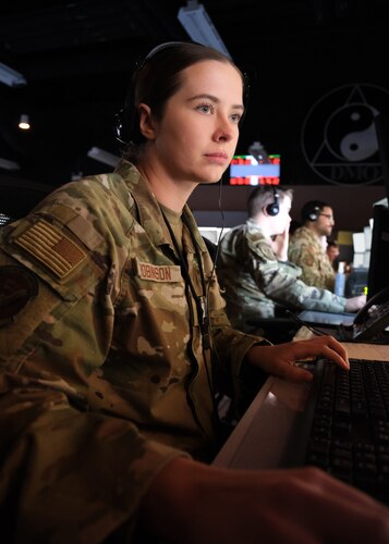 photo of US military personnel working at computers