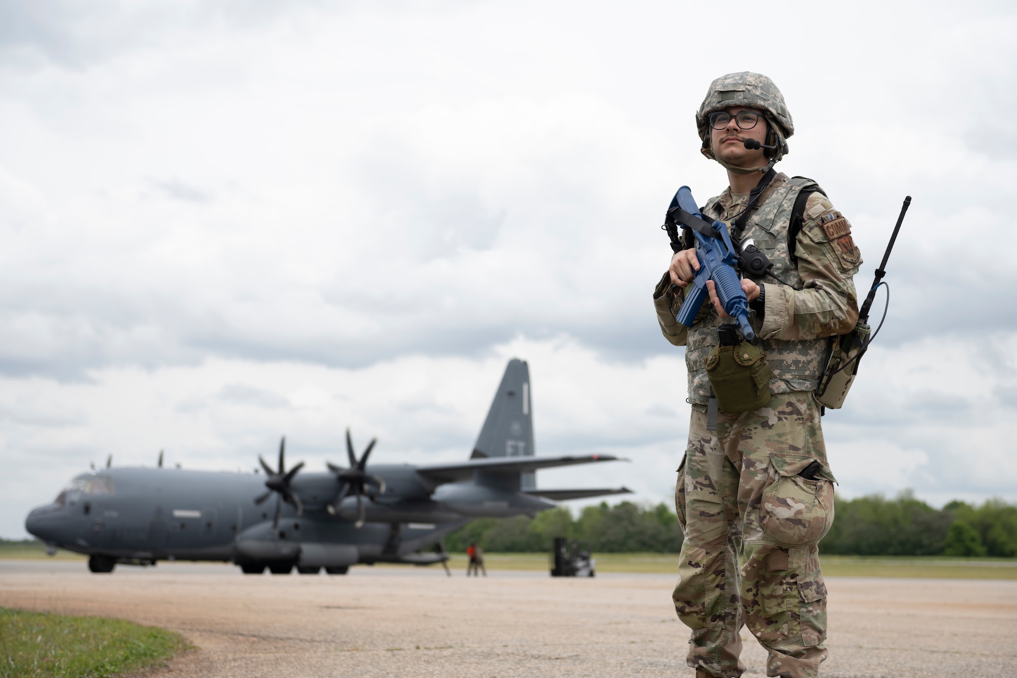 U.S. Air Force Chase Jordan-Alcañiz, 23rd Communications Squadron network instructor supervisor, pulls security on the flight line at Perry-Houston County Airport, Georgia, April 10, 2024. In support of Exercise Ready Tiger 24-1, Airmen fulfilled roles outside of their primary duties to provide base defense, protecting aircraft and personnel on the flight line. During Ready Tiger 24-1, the 23rd Wing will be evaluated on the integration of Air Force Force Generation principles such as Agile Combat Employment, integrated combat turns, forward aerial refueling points, multi-capable Airmen, and combat search and rescue capabilities. (U.S. Air Force photo by Senior Airman Rachel Coates)