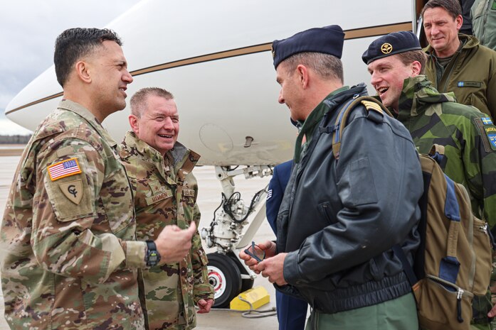 Brig. Gen. Ravi Wagh Assistant Adjutant General (ATAG,) Army, Michigan National Guard (MING,) and Brig. Gen Rolf Mammen, Commander of the Michigan Air National Guard greet Col. Carl Bergqvist, and other members of the Swedish Air Force, at the Alpena CRTC on April 3rd, 2024.The Michigan National Guard (MING) hosted members of Headquarters Air Force (HAF) and Swedish Air Force at the National All Domain Warfighting Center (NADWC) on April 3-4, 2024. The visit gave those attending a look at training venues and opportunities offered at the NADWC in Michigan. (U.S. Air National Guard photo by Tech. Sgt. Drew Schumann)