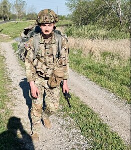 Sgt. Quentin Corrington of Peoria, Illinois, participates in the 12-mile road march during the Illinois Army National Guard’s Best Warrior Competition, April 12-14, at Sparta Training Area in Sparta, Illinois.