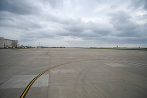 The flightline sits empty after a weather relocation at McConnell Air Force Base, Kansas, April 15, 2024. Due to the possibility of high winds and hail, the majority of McConnell's aircraft left the base for a weather relocation. (U.S. Air Force photo by Airman 1st Class William Lunn)