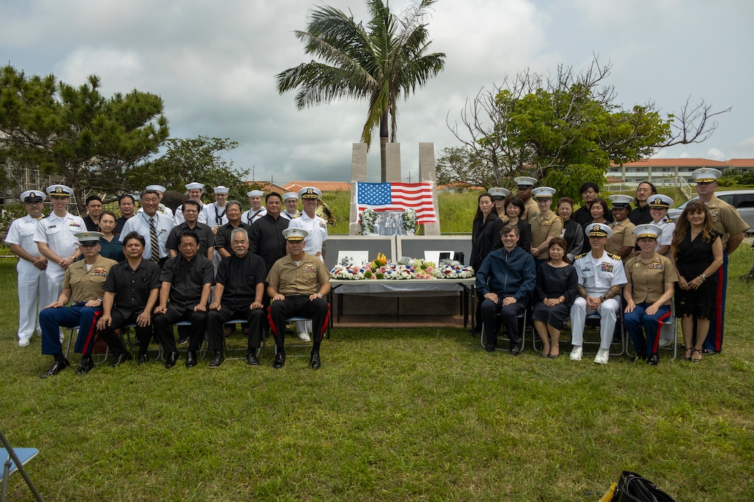 U.S. service members and distinguished guests pose for a photo during the Ishigaki Memorial Ceremony on Ishigaki, Okinawa, Japan, April 15, 2024. The ceremony honors three fallen World War II U.S. Navy airmen, whom died shortly after crash landing on the island. The memorial was developed by the people of Ishigaki and U.S. Service members as a symbol of peace and friendship. (U.S. Marine Corps photo by Lance Cpl. Jeffrey Pruett)