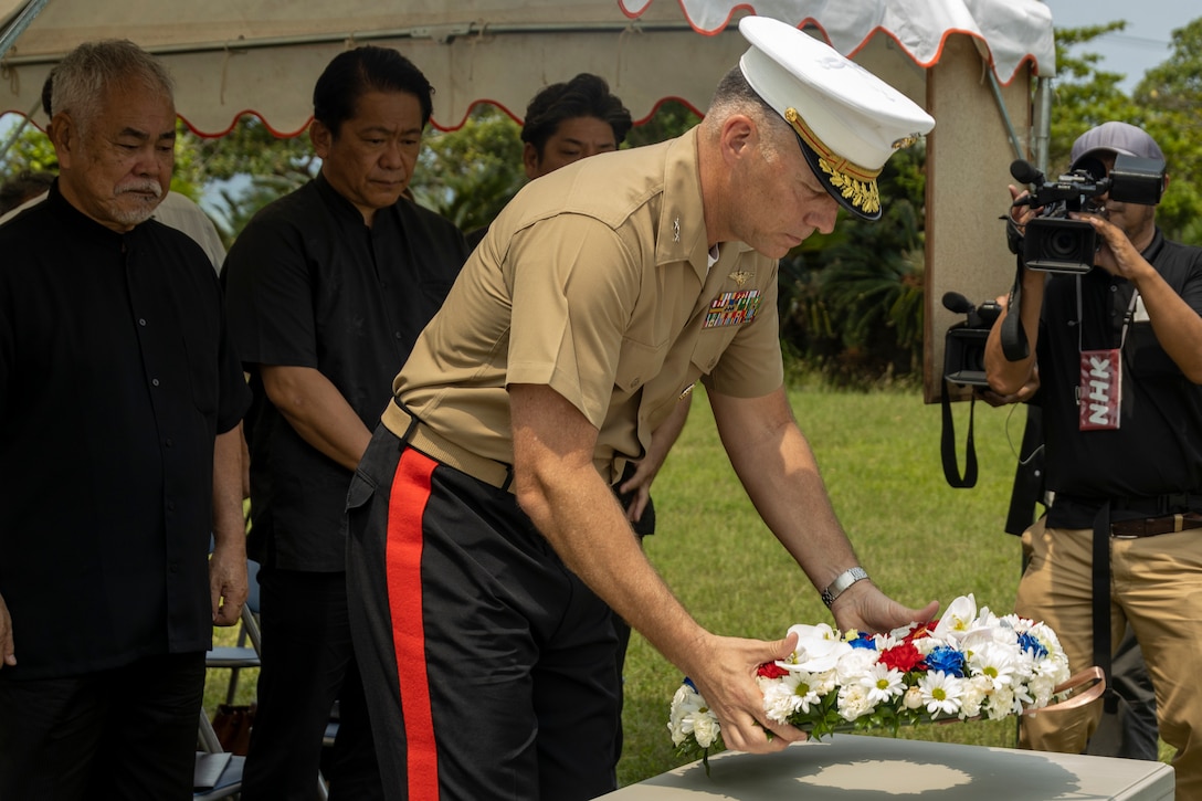 U.S. Marine Corps Maj. Gen. Eric Austin, commanding general of 1st Marine Aircraft Wing, lays a wreath during the Ishigaki Memorial Ceremony on Ishigaki, Okinawa, Japan, April 15, 2024. The ceremony honors three fallen World War II U.S. Navy airmen, whom died shortly after crash landing on the island. The memorial was developed by the people of Ishigaki and U.S. Service members as a symbol of peace and friendship. Austin is a native of Oregon. (U.S. Marine Corps photo by Lance Cpl. Jeffrey Pruett)
