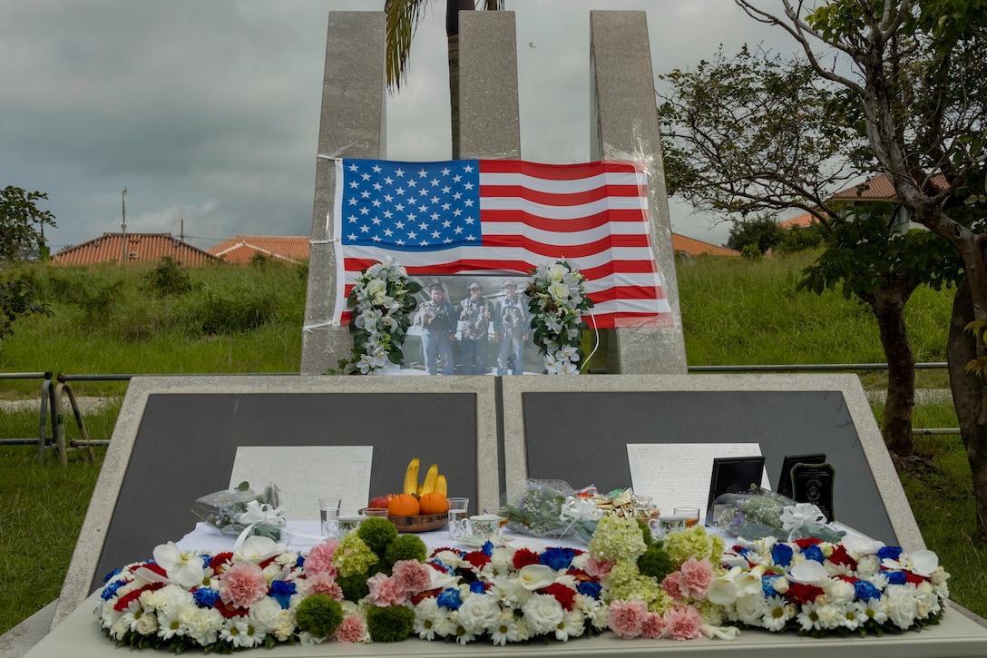 Wreaths and memorial offerings are displayed in front of the Bilingual Ishigaki Memorial during the Ishigaki Memorial Ceremony on Ishigaki, Okinawa, Japan, April 15, 2024. The ceremony honors three fallen World War II U.S. Navy airmen, whom died shortly after crash landing on the island. The memorial was developed by the people of Ishigaki and U.S. Service members as a symbol of peace and friendship. (U.S. Marine Corps photo by Lance Cpl. Jeffrey Pruett)
