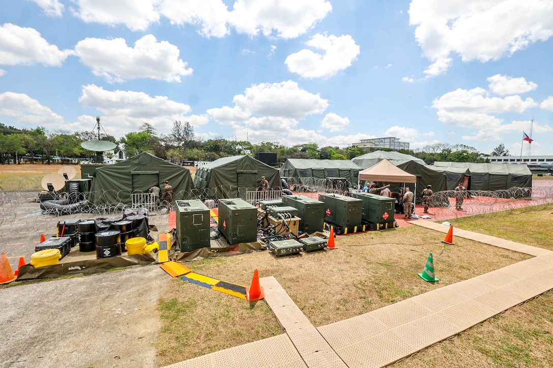 Service members from across the Armed Forces of the Philippines and U.S. Marines with I Marine Expeditionary Unit establish a command and control node for the Information Warfighter Exercise, held before the conduct of Exercise Balikatan 24, at Camp Aguinaldo, Philippines, April 4, 2024. IWX is a week-long matrix-style wargame that advances the combined information-related capabilities of the U.S. and Armed Forces of the Philippines. BK 24 is an annual exercise between the Armed Forces of the Philippines and the U.S. military designed to strengthen bilateral interoperability, capabilities, trust, and cooperation built over decades of shared experiences. (U.S. Marine Corps photo by Cpl. Brian Knowles)
