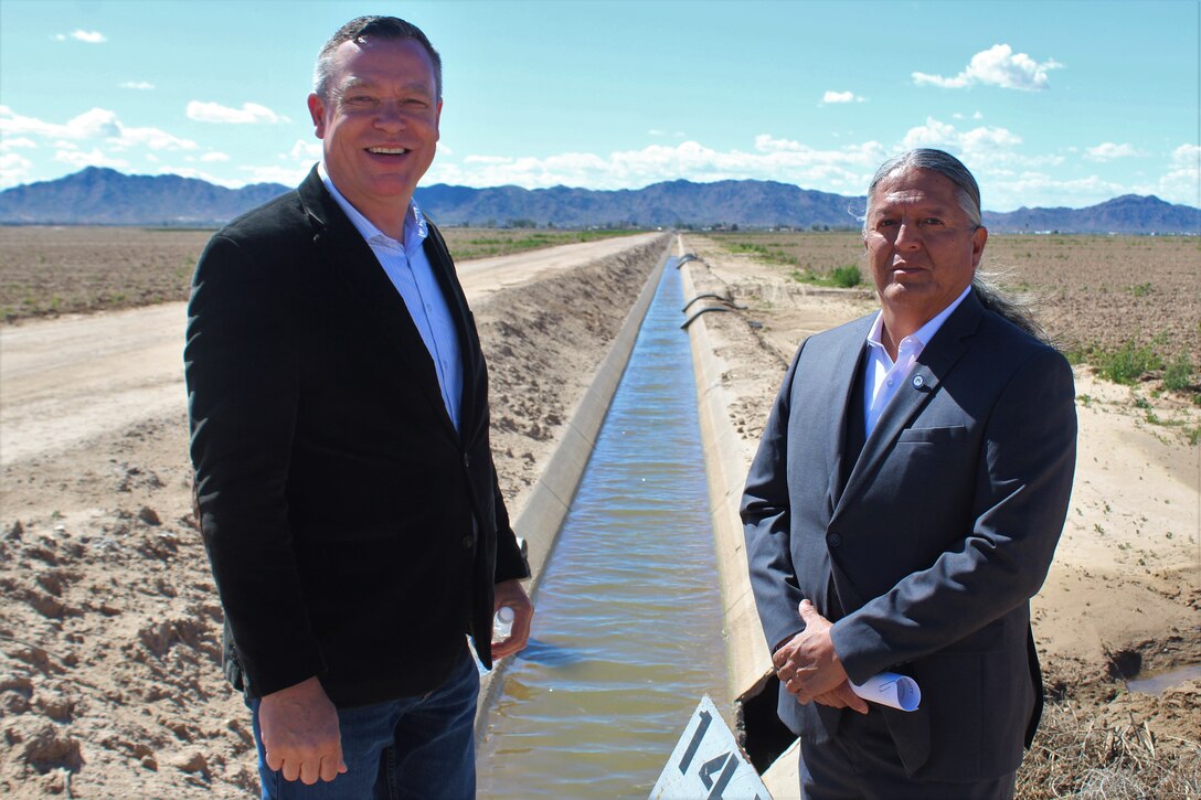 Los Angeles District Deputy Engineer Justin Gay, left, and Luther Lee, Tribal engagement director for Senator Mark Kelly, right, tour a potential project site for the Ak-Chin Indian community March 25 near Maricopa, Arizona.