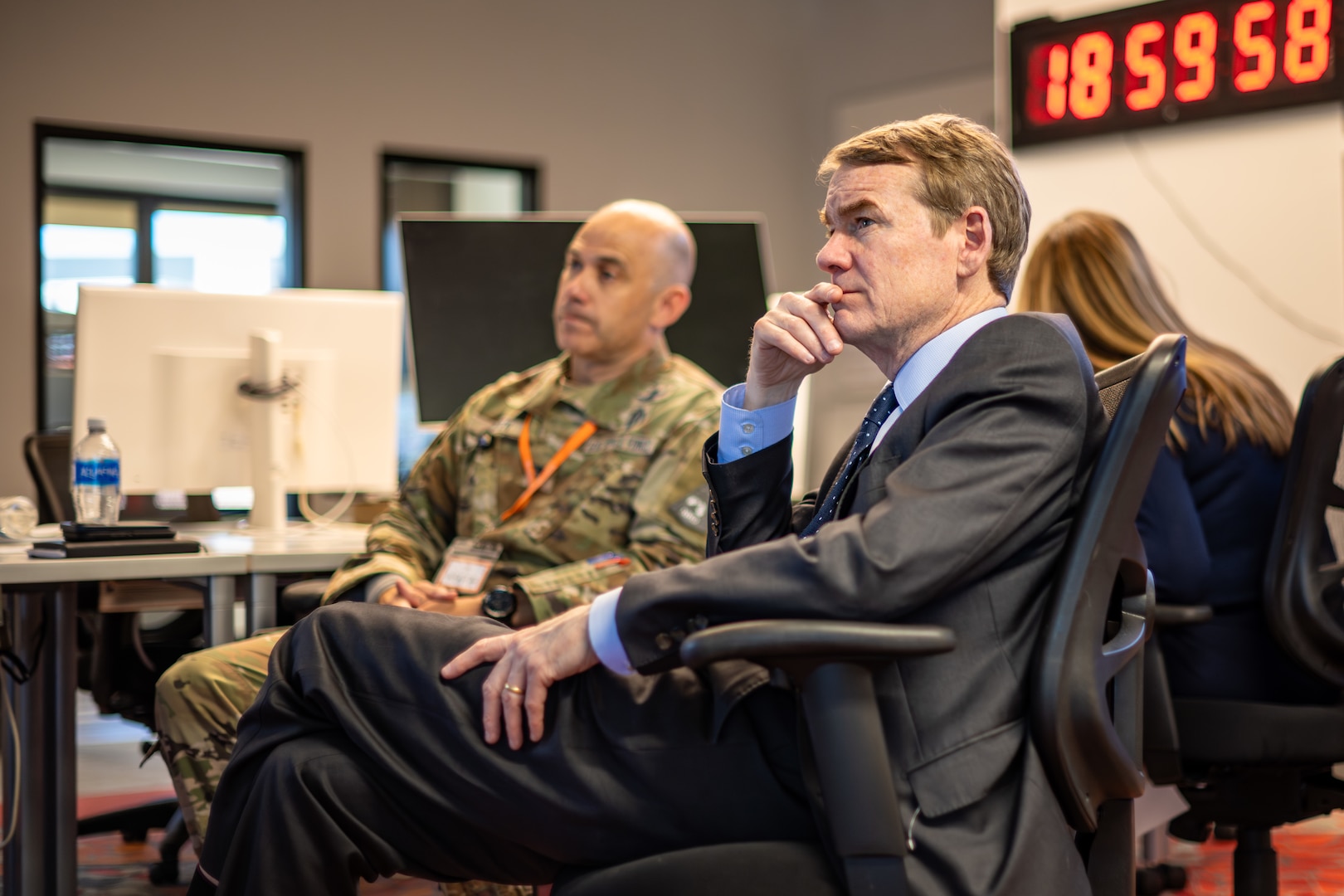 Senior U.S. Sen. Michael Bennet of Colorado listens during an immersion of the Joint Commercial Operations cell at Colorado Springs, Colo., April 4, 2024. The JCO is an extension of the National Space Defense Center operations floor, and it leverages commercial providers to provide diverse, timely Space Domain Awareness in direct support of the NSDC’s core protect and defend mission. The NSDC is one of five operations centers for U.S. Space Forces – Space. The S4S mission is to plan, integrate, conduct, and assess global space operations in order to deliver combat relevant space effects, in, from, and to space, for Combatant Commanders, Coalition partners, the Joint Force, and the Nation.  (U.S. Space Force photo by Dalton Prejeant)