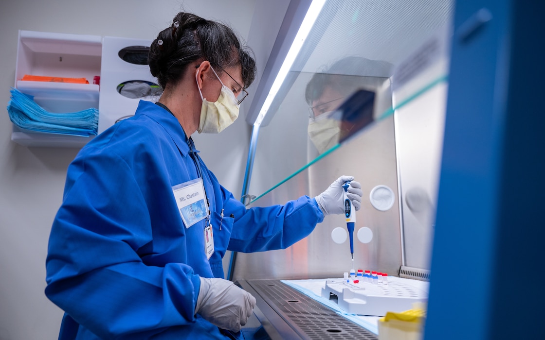 Sherri Chastain, 56th Medical Group medical laboratory technologist, tests fluid samples for the flu, the common cold, and COVID-19, July 13, 2022, at Luke Air Force Base, Arizona.