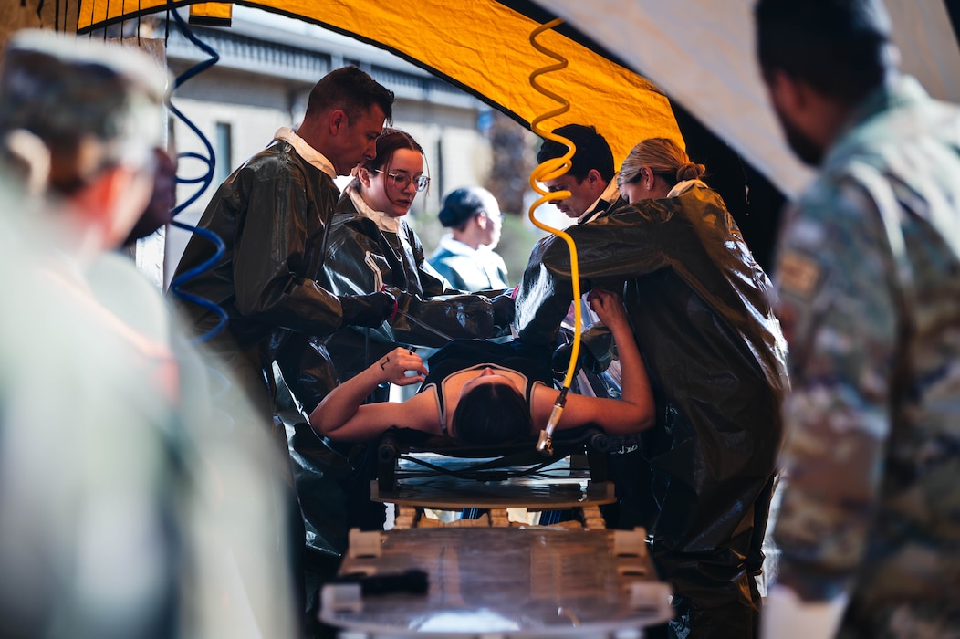 U.S. Air Force Airmen from the 56th Medical Group perform decontamination procedures on a moulage patient during exercise Ready Eagle II, Feb. 15, 2024, at Luke Air Force Base, Arizona.