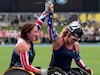 Retired Army Sgt. Brandi Evans (right) and Royal Air Force Corporal Naomi "Nomes" Adie show their bond as Aide crosses the finish line to win the bronze after the 1500-meter wheelchair race in Sydney at the 2018 Invictus Games.