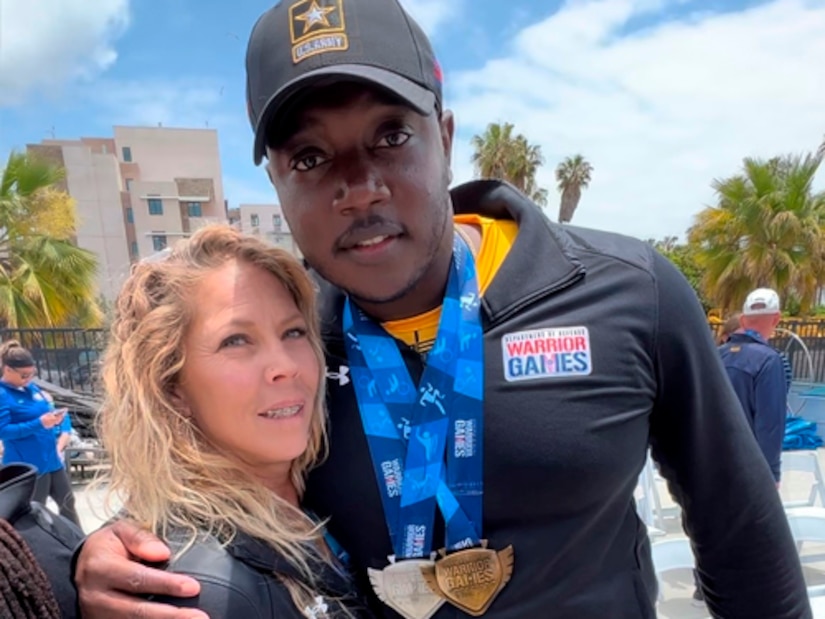 Mentor Brandi Evans Congratulates Team Army’s Sgt. Bill Anderson on his big win after rowing competition at the 2023 Warrior Games