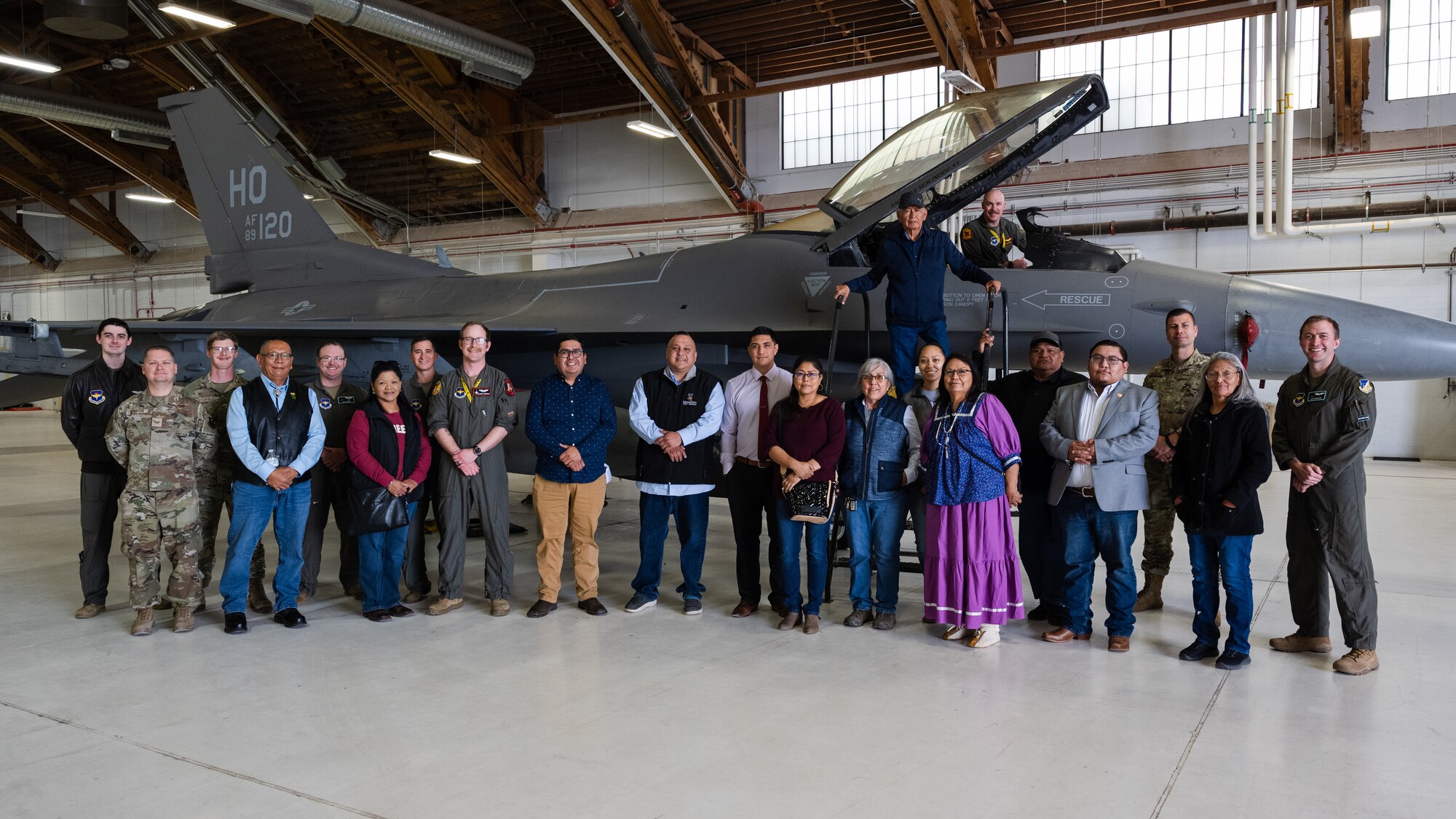 Mescalero Apache Tribe council members and leadership pose for a photo in front of an F-16 Viper with 49th Wing aircrew at Holloman Air Force Base, New Mexico, April 1, 2024.