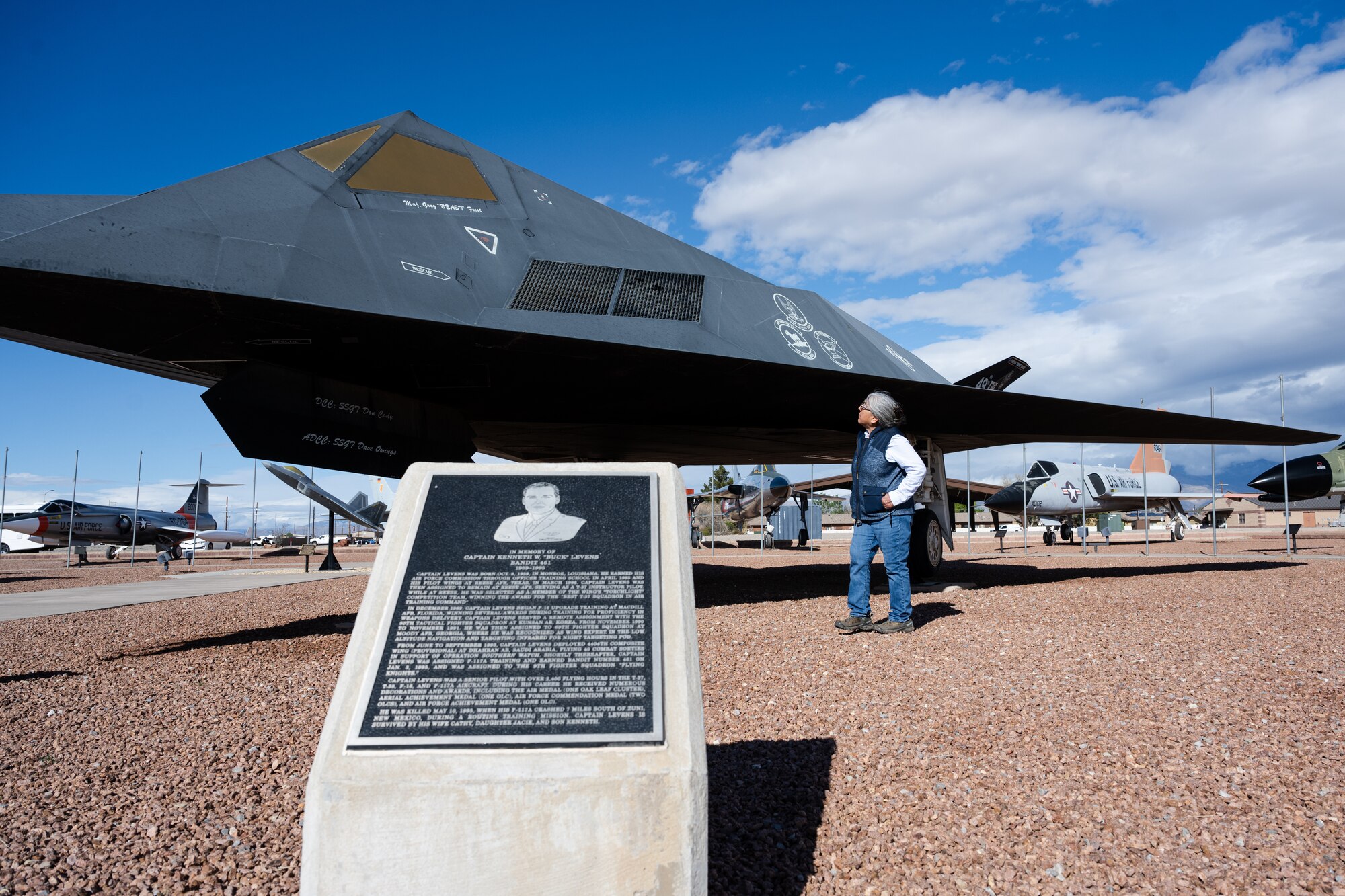Thora Walsh-Padilla, Mescalero Tribe president, examines the F-117 Nighthawk that is displayed in Heritage Park at Holloman Air Force Base, New Mexico, April 1, 2024.