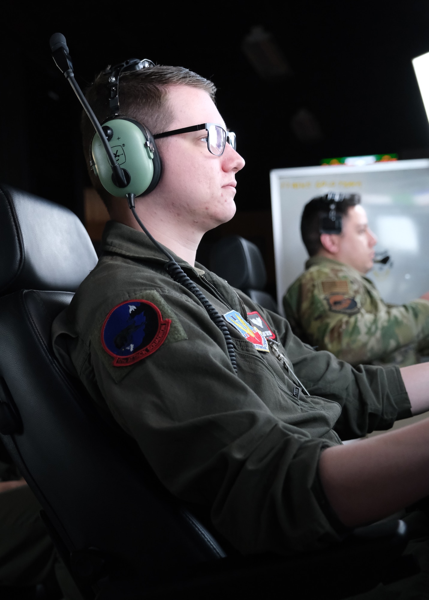 photo of US military personnel flying at simulators