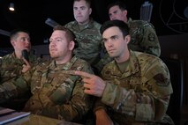 photo of US military personnel working at computers