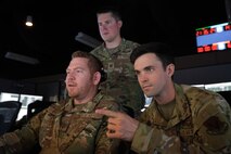 photo of US military personnel working at computers