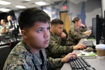 photo of US military personnel working at computers