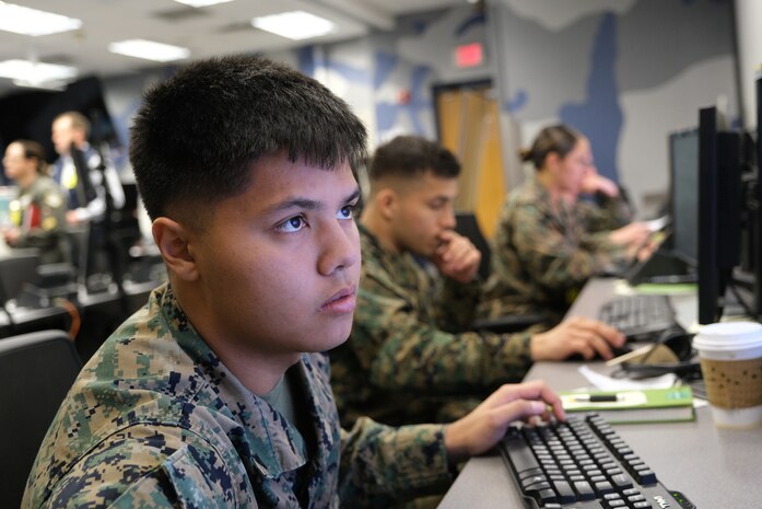 photo of US military personnel working at computers