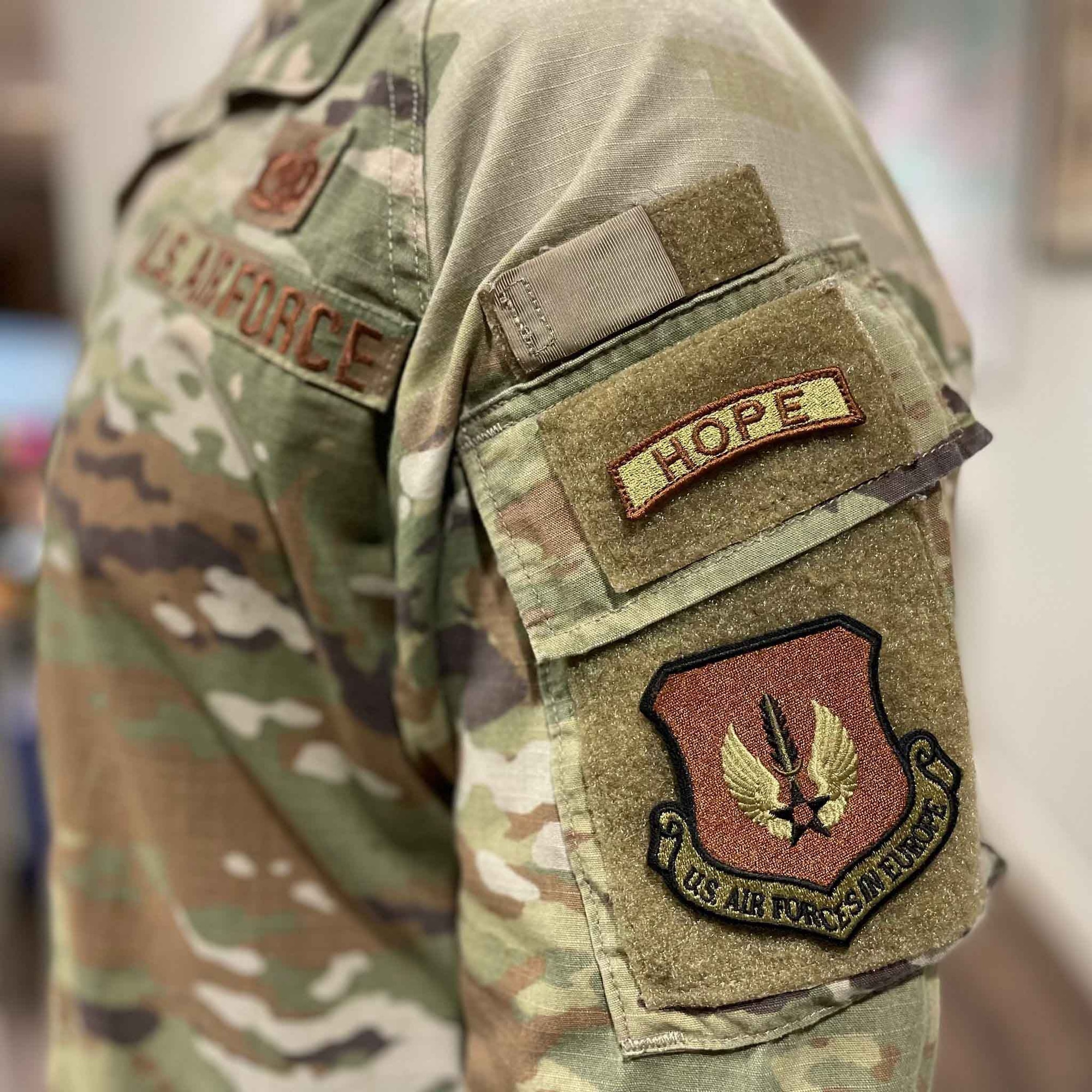 HOPE specialists may wear a provisional HOPE tab on their uniform at Royal Air Force Lakenheath, England. To earn the tab, participants must attend six months of education in spiritual fitness, leadership development, volunteering, communication, and suicide intervention. (U.S. Air Force courtesy photo by Maj. Justin Szeker)