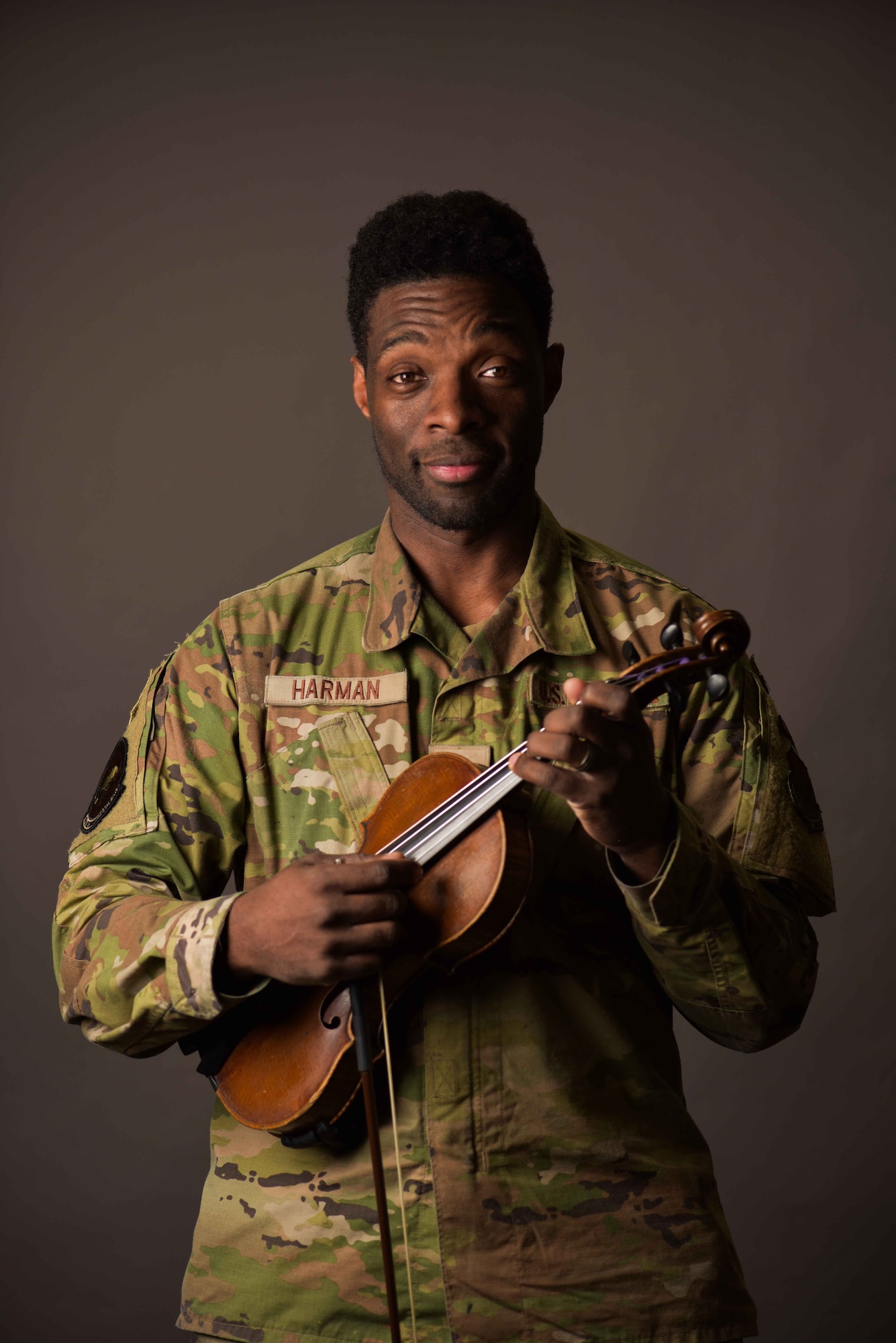 U.S. Air Force Senior Airman Joshua Harman, 95th Reconnaissance Squadron avionics journeyman, poses for a photo before playing the violin at Royal Air Force Mildenhall, England, April 3, 2024. Harman is the first HOPE specialist at the 95th RS. The HOPE spiritual fitness initiative is a community program that fosters connection among Airmen by promoting resilience, volunteering, morale, leadership, and spiritual growth inclusive to all religious beliefs. (U.S. Air Force photo by Senior Airman Viviam Chiu)