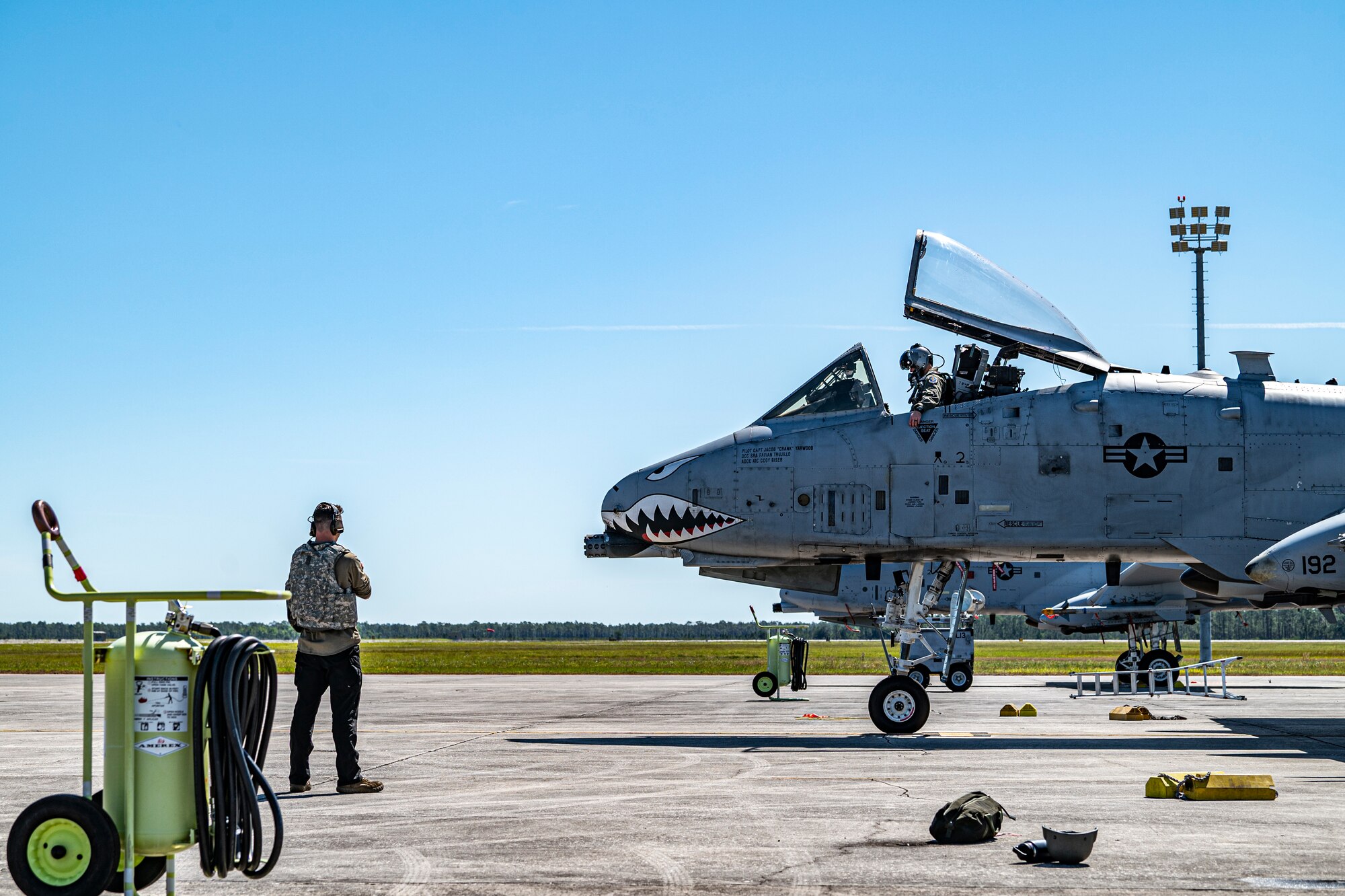 U.S. Air Force Airman 1st Class Conner Holman, 74th Fighter Generation Squadron crew chief, prepares to launch an A-10C Thunderbolt II for Exercise Ready Tiger 24-1 at Avon Park Air Force Range, Florida, April 12, 2024. Maintenance Airmen and pilots worked in tandem to generate sorties at a contingency location with limited equipment and personnel. Ready Tiger 24-1 is a readiness exercise demonstrating the 23rd Wing’s ability to plan, prepare and execute operations and maintenance to project air power in contested and dispersed locations, defending the United States’ interests and allies. (U.S. Air Force photo by Airman 1st Class Leonid Soubbotine)