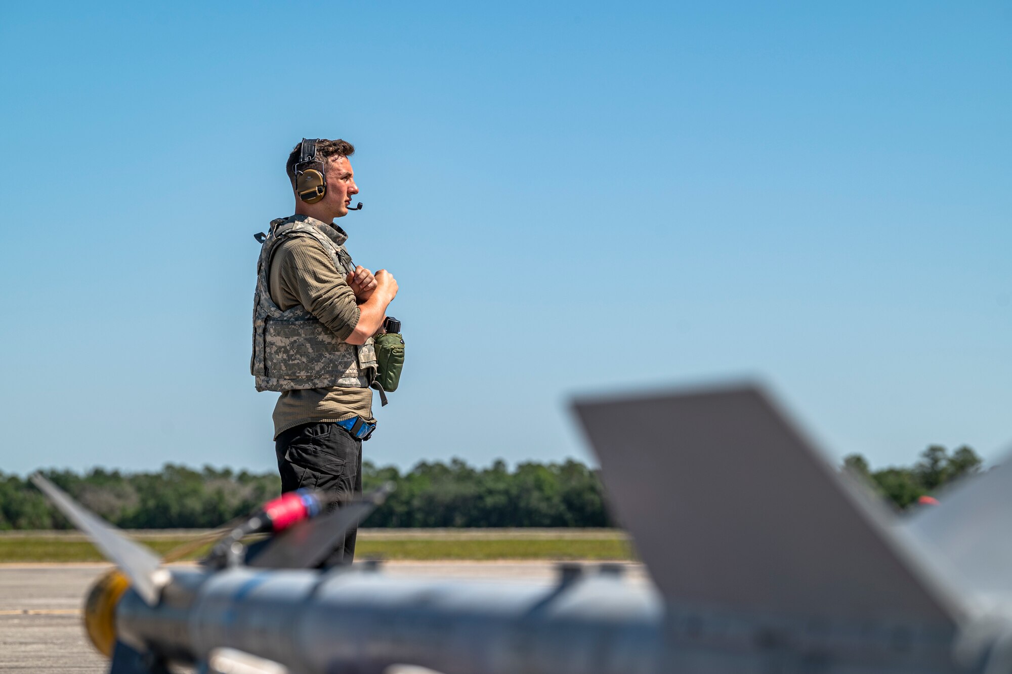U.S. Air Force Airman 1st Class Conner Holman, 74th Fighter Generation Squadron crew chief, communicates with an A-10C Thunderbolt II pilot during Exercise Ready Tiger 24-1 at Avon Park Air Force Range, Florida, April 12, 2024. Crew chiefs ensure aircrew and their aircraft are ready to execute the mission at a moment’s notice regardless of their location. Ready Tiger 24-1 is a readiness exercise demonstrating the 23rd Wing’s ability to plan, prepare and execute operations and maintenance to project air power in contested and dispersed locations, defending the United States’ interests and allies. (U.S. Air Force photo by Airman 1st Class Leonid Soubbotine)
