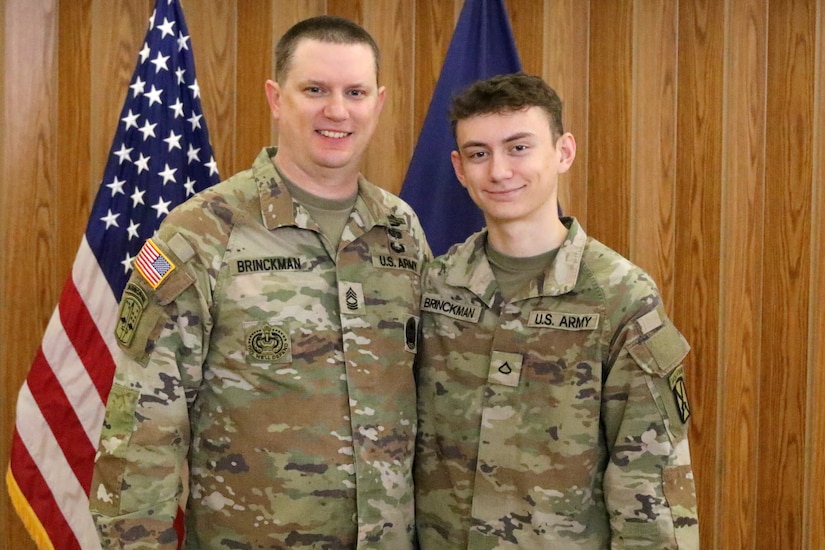 Master Sgt. Nicholas Brinckman (left) and son Pfc. Laiken Brinckman pose for a photo following the former's retirement ceremony at Fort Indiantown Gap, Pa. April 8, 2024. (U.S. Army National Guard photo by Sgt. 1st Class Shane Smith)