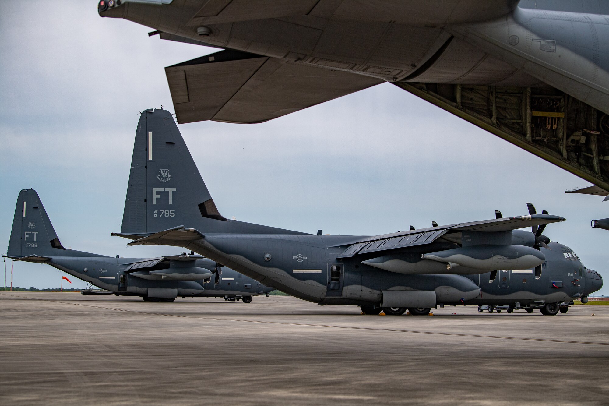 Three HC-130J Combat King II aircraft assigned to the 71st Rescue Squadron sit on the flightline during Exercise Ready Tiger 24-1 at Savannah Air National Guard Base, Georgia, April 10, 2024. Ready Tiger 24-1 serves as a steppingstone to prepare for Agile Flag, an Air Force Force Generation certifying exercise, later this year. Built upon Air Combat Command's directive to assert air power in contested environments, Exercise Ready Tiger 24-1 aims to test and enhance the 23rd Wing’s proficiency in executing Lead Wing and Expeditionary Air Base concepts through Agile Combat Employment and command and control operations. (U.S. Air Force photo by Senior Airman Courtney Sebastianelli)