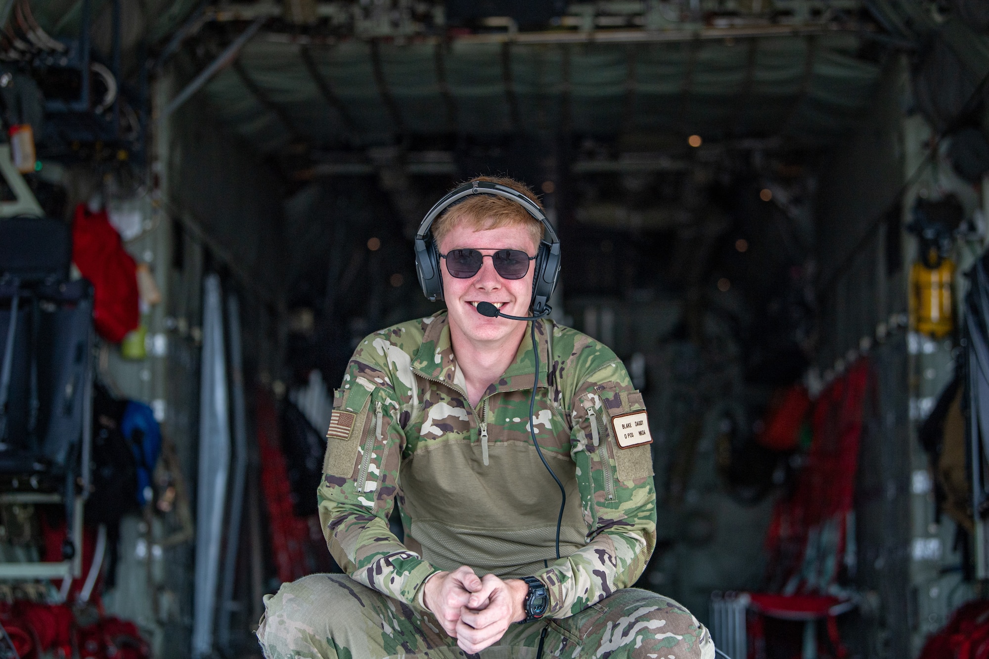 U.S. Air Force Airman 1st Class Blake Daggy, 71st Rescue Squadron loadmaster, poses for a photo during Exercise Ready Tiger 24-1 at Savannah Air National Guard Base, Georgia, April 10, 2024. During Ready Tiger 24-1, the 23rd Wing will be evaluated on the integration of Air Force Force Generation principles such as Agile Combat Employment, integrated combat turns, forward aerial refueling points, multi-capable Airmen, and combat search and rescue capabilities. (U.S. Air Force photo by Senior Airman Courtney Sebastianelli)