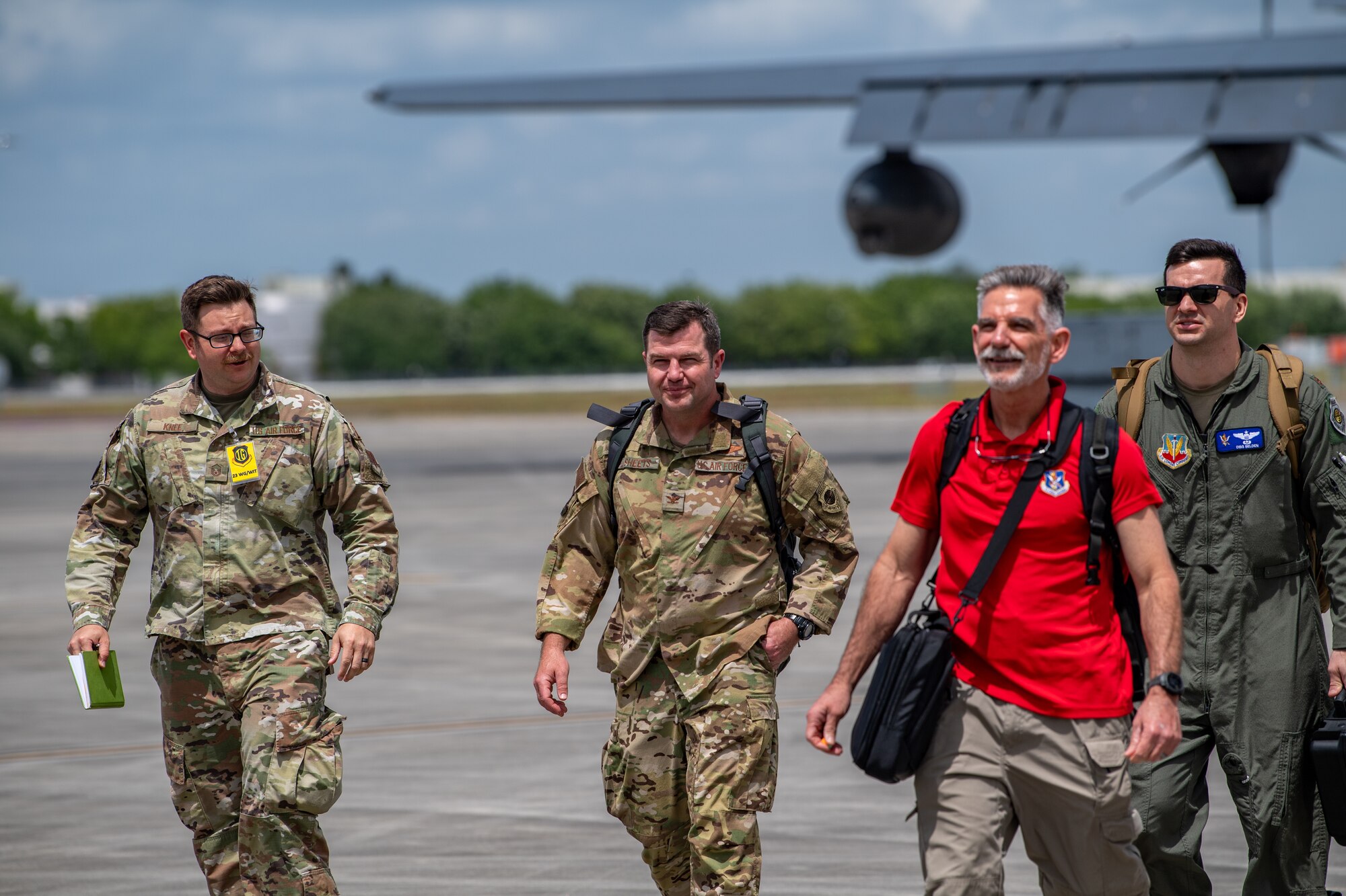 U.S. Air Force Col. Paul Sheets, 23rd Wing commander (second from left), arrives to the main operating base during Exercise Ready Tiger 24-1 at Savannah Air National Guard Base, Georgia, April 10, 2024. During Ready Tiger 24-1, exercise inspectors will assess the 23rd Wing's proficiency in employing decentralized command and control to fulfill air tasking orders across geographically dispersed areas amid communication challenges, integrating Agile Combat Employment principles such as integrated combat turns, forward aerial refueling points, multi-capable Airmen, and combat search and rescue capabilities. (U.S. Air Force photo by Senior Airman Courtney Sebastianelli)