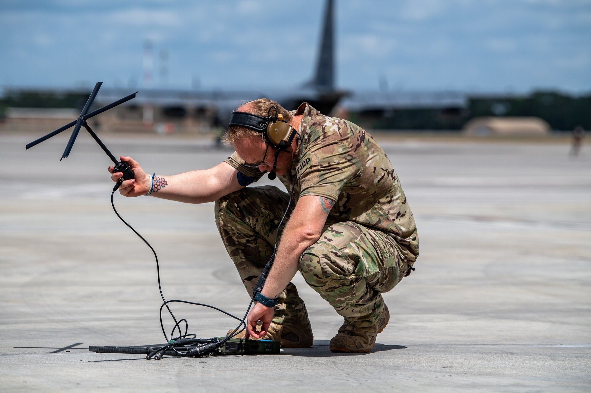 A U.S. Air Force Airman assigned to the 38th Rescue Squadron searches for a signal with a satellite communication radio antenna during Exercise Ready Tiger 24-1 at Savannah Air National Guard Base in Savannah, Georgia, April 10, 2024. During Ready Tiger 24-1, the 23rd Wing will be evaluated on the integration of Air Force Force Generation principles such as Agile Combat Employment, integrated combat turns, forward aerial refueling points, multi-capable Airmen, and combat search and rescue capabilities. (U.S. Air Force photo by Senior Airman Courtney Sebastianelli)