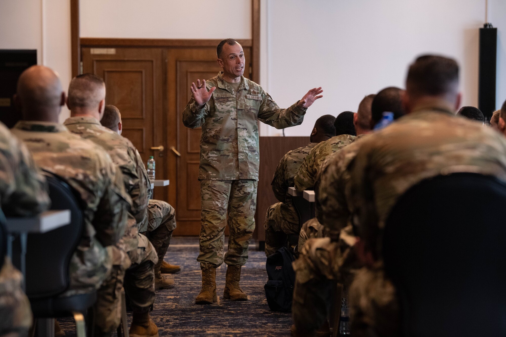 U.S. Air Force Chief Master Sgt. John Alsvig, Air Force first sergeant special duty manager, speaks during a first sergeant symposium at Ramstein Air Base, Germany, April 2, 2024. The aim of the first sergeant symposium was to enhance the professional development of first sergeants across U.S. Air Forces in Europe and Air Forces Africa, equipping them with essential tools and strategies to better serve their units. (U.S. Air Force photo by Senior Airman Jared Lovett)