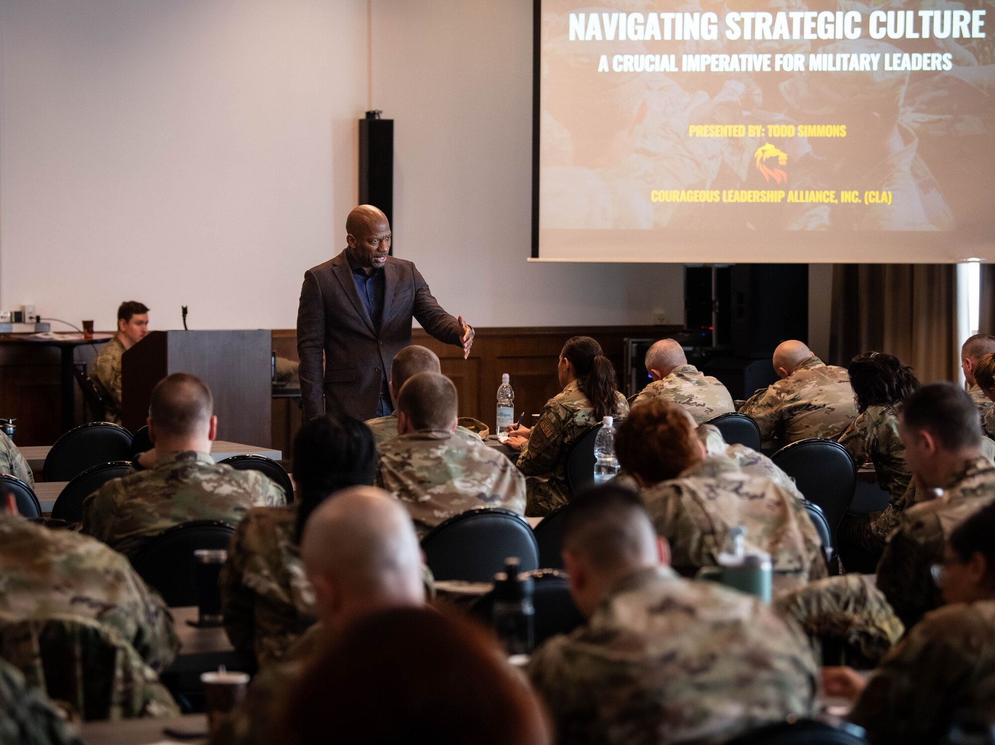 Retired U.S. Air Force Chief Master Sgt. Todd Simmons, founder of Courageous Leaders Alliance, speaks during a first sergeant symposium at Ramstein Air Base, Germany, April 2, 2024. The aim of the first sergeant symposium was to enhance the professional development of first sergeants across U.S. Air Forces in Europe and Air Forces Africa, equipping them with essential tools and strategies to better serve their units. (U.S. Air Force photo by Senior Airman Jared Lovett)