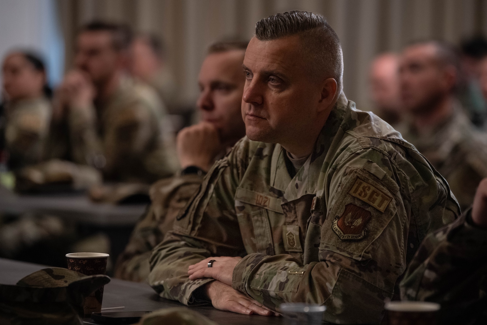 U.S. Air Force Master Sgt. Tomasz Idzi, 52nd Communications Squadron first sergeant assigned to Spangdahlem Air Base, Germany, attends a first sergeant symposium at Ramstein Air Base, Germany, April 3, 2024. Recognizing the pivotal role first sergeants play in maintaining discipline, morale and readiness within their units, the symposium offered a platform for them to immerse themselves in professional growth opportunities. (U.S. Air Force photo by Senior Airman Jared Lovett)