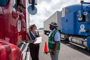 FEMA personnel lead a logistics exercise featuring emergency scenarios with semi-trucks at the Eagle Raising 3.0 event, supported by Air Force Emergency Management, at Homestead Air Reserve Base, Florida, on April 10, 2024.