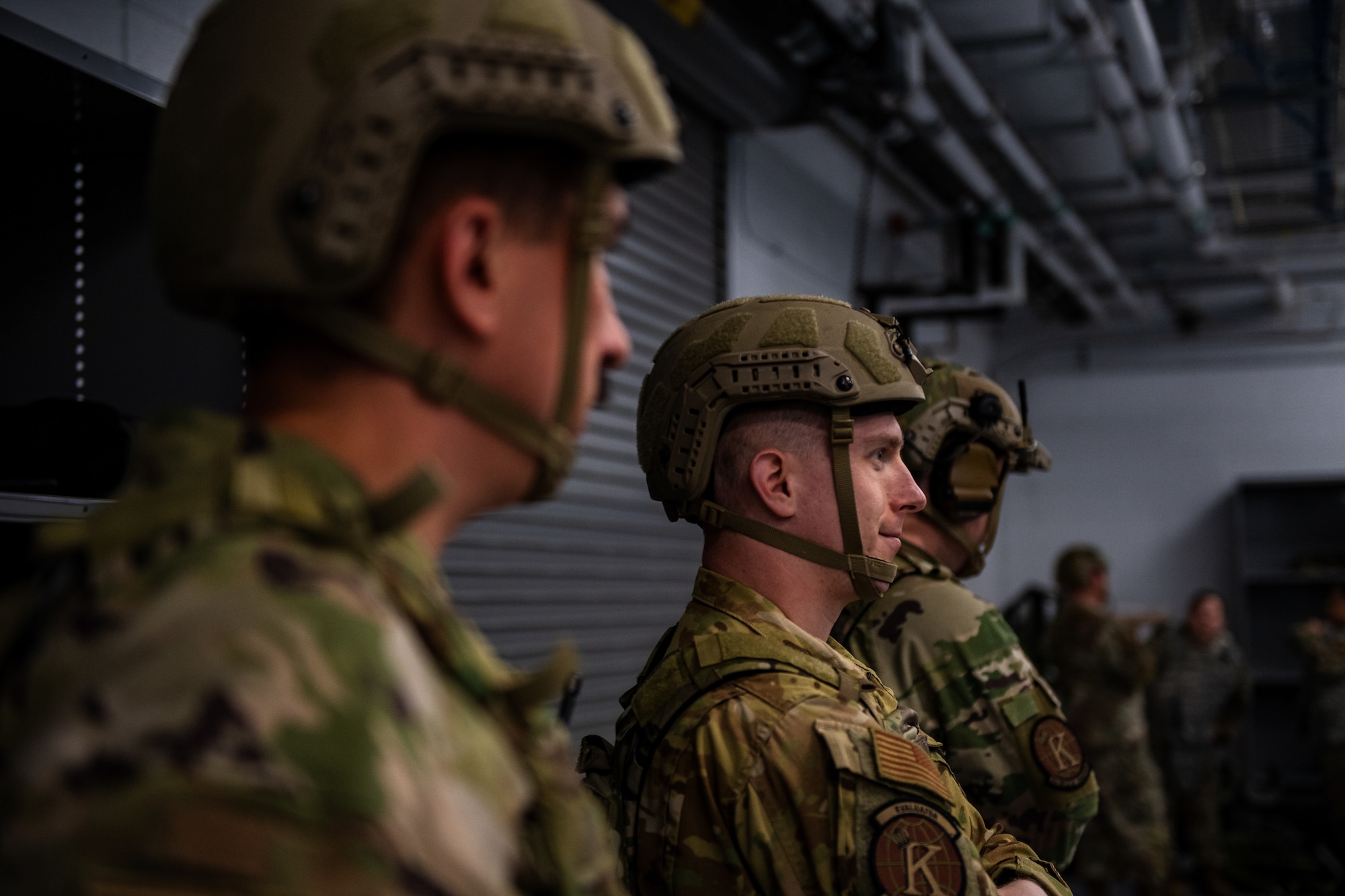 U.S. Air Force Capt. Jacob Laheta, 71st Rescue Squadron evaluator pilot, listens to a forward operating site (FOS) brief during Exercise Read Tiger 24-1 at Savannah Air National Guard Base in, Georgia, April 12, 2024. The FOS responded to planned scenarios in a simulated Indo-Pacific area of responsibility. During Ready Tiger 24-1, exercise inspectors will assess the 23rd Wing's proficiency in employing decentralized command and control to fulfill air tasking orders across geographically dispersed areas amid communication challenges, integrating Agile Combat Employment principles such as integrated combat turns, forward aerial refueling points, multi-capable Airmen, and combat search and rescue capabilities. (U.S. Air Force photo by Senior Airman Courtney Sebastianelli)