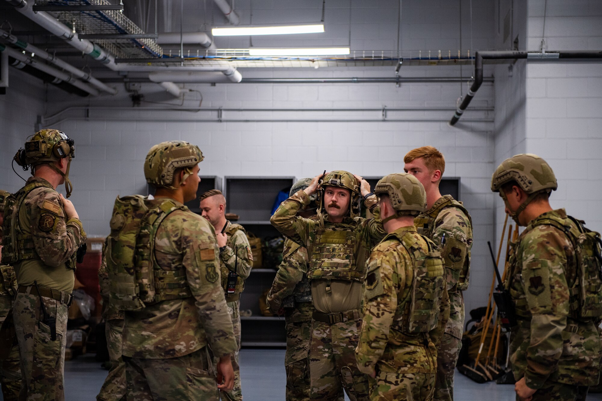 U.S. Air Force Airmen assigned to the 23rd Wing put on battle rattle in response to a simulated attack at the forward operating site (FOS) during Exercise Ready Tiger 24-1 at the Savannah Air National Guard Base, Georgia, April 12, 2024. Personnel at the FOS responded to different scenarios that tested their ability to support transporting cargo and responding to combat search and rescue missions. During Ready Tiger 24-1, the 23rd Wing will be evaluated on the integration of Air Force Force Generation principles such as Agile Combat Employment, integrated combat turns, forward aerial refueling points, multi-capable Airmen, and combat search and rescue capabilities. (U.S. Air Force photo by Senior Airman Courtney Sebastianelli)