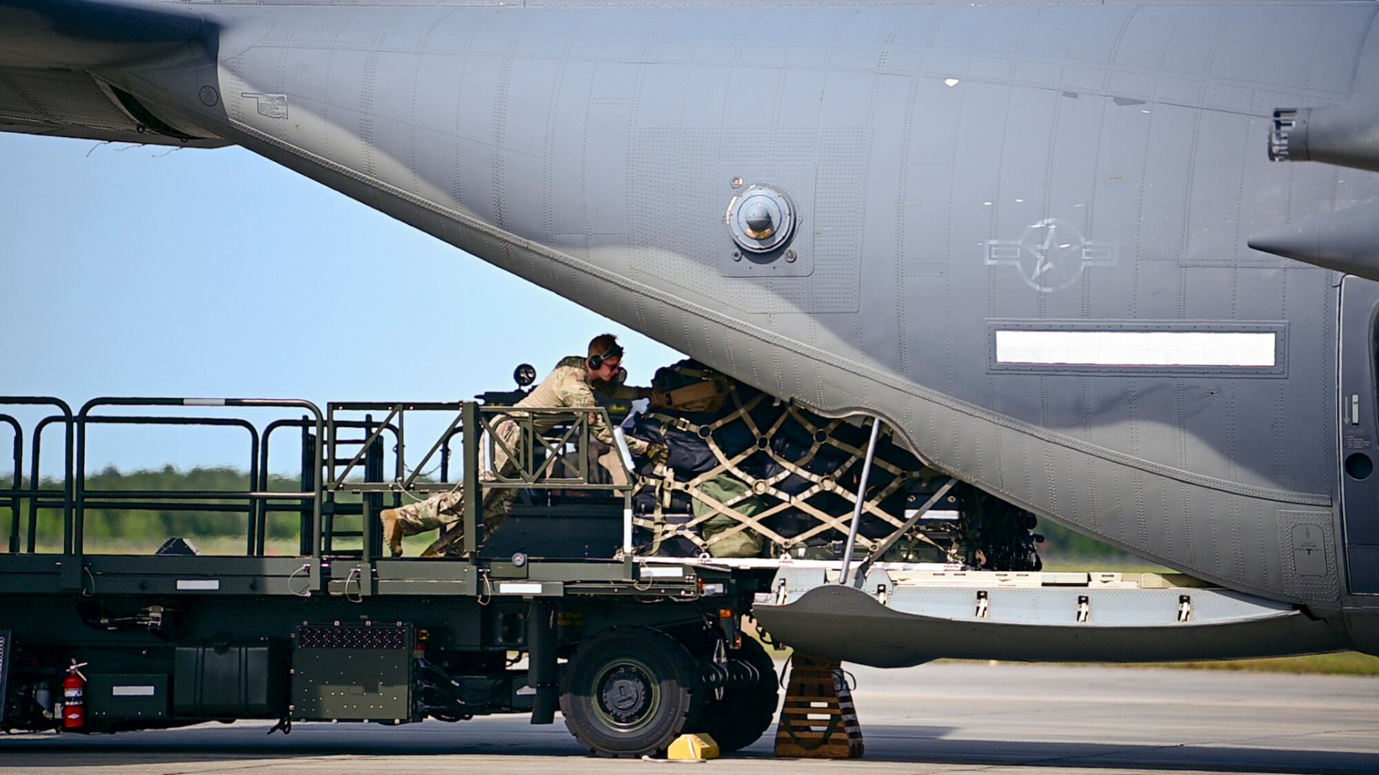 U.S Air Force Airmen assigned to the 23rd Wing load equipment onto an HC-130J Combat King II from the 71st Rescue Squadron at Moody Air Force Base, Georgia, April 8, 2024. Airmen from the 23rd Wing are prepared to assist in any operation that is pertinent to exercises regarding Moody AFB, Air Combat Command and the U.S. Air Force. Ready Tiger 24-1 is a readiness exercise demonstrating the 23rd Wing’s ability to plan, prepare and execute operations and maintenance to project air power in contested and dispersed locations, defending the United States’ interests and allies. (U.S. Air Force photo by 2nd Lt. Benjamin Williams)