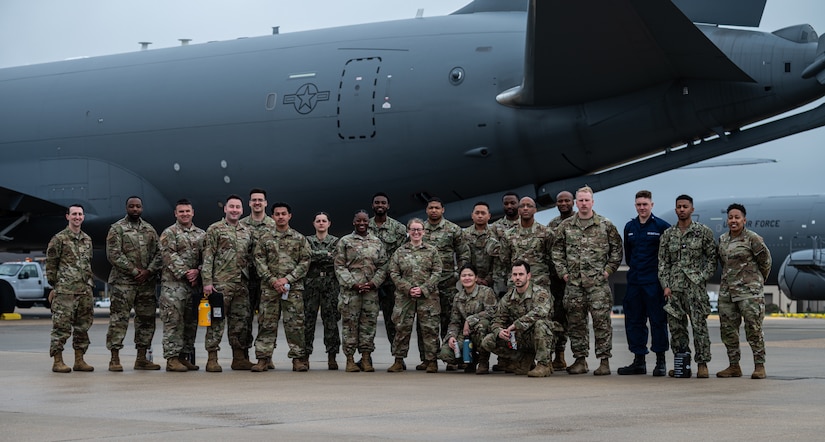 Service members stand in front of a U.S. Air Force KC-46A Pegasus refueling aircraft during the Leading Edge course at Joint Base McGuire-Dix-Lakehurst, N.J., April 12, 2024. Offered twice a year, Leading Edge is a one-of-a-kind joint operations-focused course sponsored by JB MDL Top 3 committee and open to service members in ranks E-4 to E-6 from all military branches. (U.S. Air Force photo by Senior Airman Sergio Avalos)