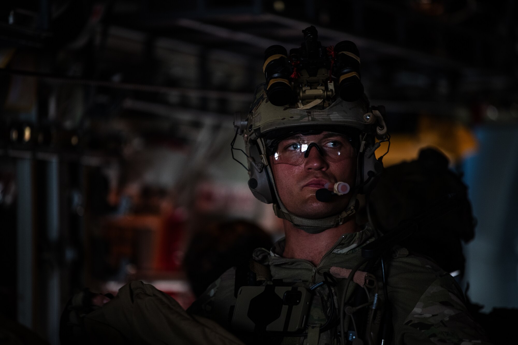 A U.S. Air Force Airman assigned to the 38th Rescue Squadron prepares for a military free fall jump during Exercise Ready Tiger 24-1 at Savannah Air National Guard Base, Georgia, April 11, 2024. The exercise simulated a downed pilot scenario which tested the combat search and rescue team’s ability to respond at a moment's notice from a forward operating site. During Ready Tiger 24-1, exercise inspectors will assess the 23rd Wing's proficiency in employing decentralized command and control to fulfill air tasking orders across geographically dispersed areas amid communication challenges, integrating Agile Combat Employment principles such as integrated combat turns, forward aerial refueling points, multi-capable Airmen, and combat search and rescue capabilities. (U.S. Air Force photo by Senior Airman Courtney Sebastianelli)