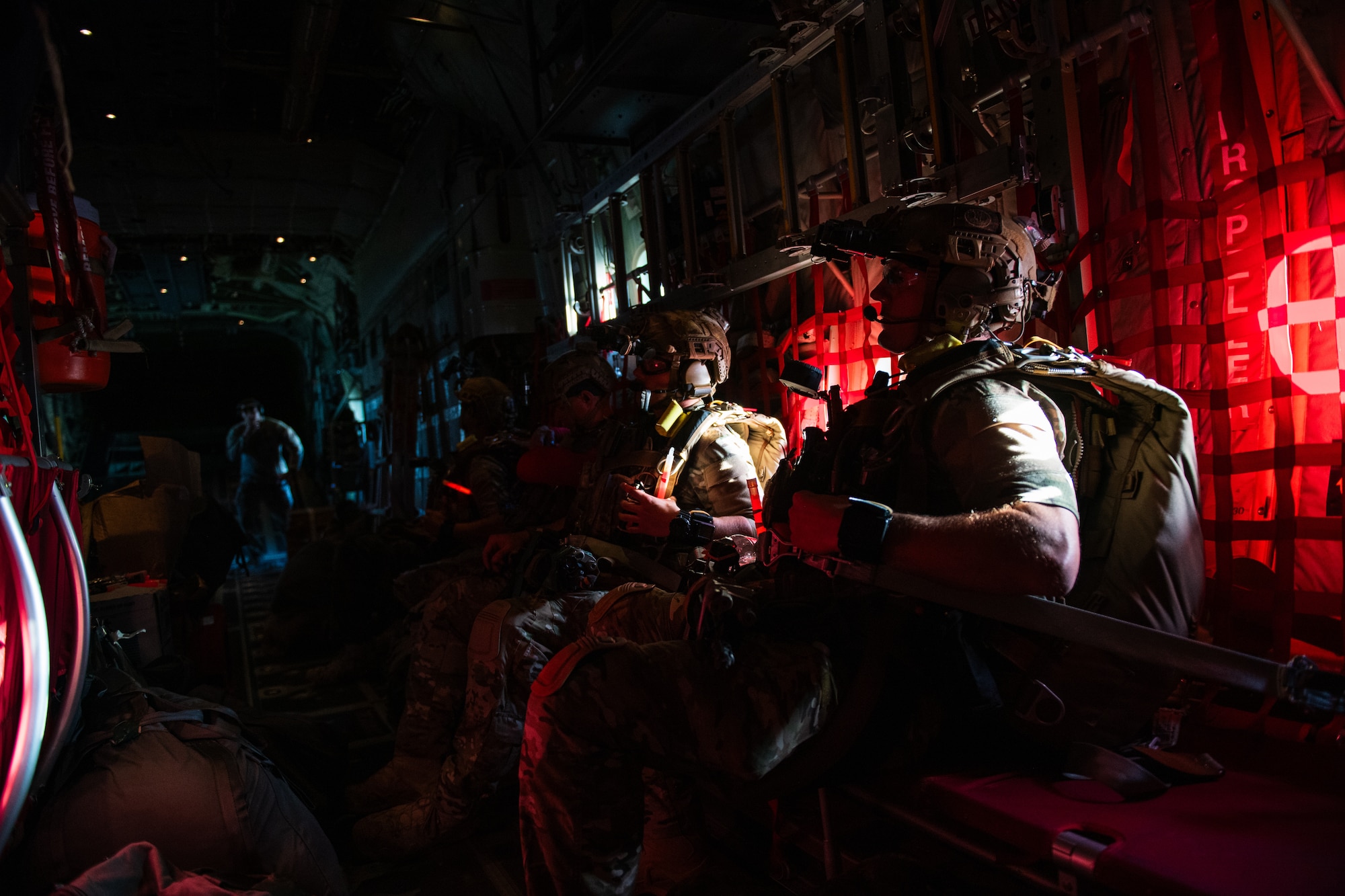 U.S. Air Force Airmen assigned to the 38th Rescue Squadron prepare for a military free fall jump during Exercise Ready Tiger 24-1 at Savannah Air National Guard Base, Georgia, April 11, 2024. The exercise simulated a downed pilot scenario which tested the combat search and rescue team’s ability to respond at a moment's notice from a forward operating site (FOS). During Ready Tiger 24-1, exercise inspectors will assess the 23rd Wing's proficiency in employing decentralized command and control to fulfill air tasking orders across geographically dispersed areas amid communication challenges, integrating Agile Combat Employment principles such as integrated combat turns, forward aerial refueling points, multi-capable Airmen, and combat search and rescue capabilities. (U.S. Air Force photo by Senior Airman Courtney Sebastianelli)